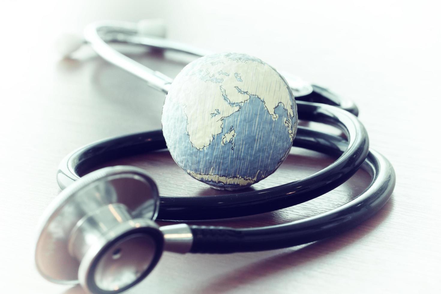 Studio macro of a stethoscope and texture globe with shallow DOF evenly matched abstract as medical network concept Elements of this image furnished by NASA photo