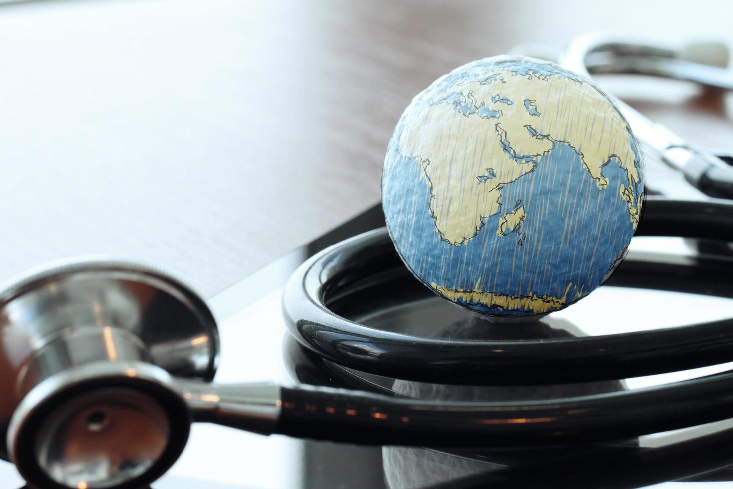 Studio macro of a stethoscope and texture globe with digital tablet with shallow DOF evenly matched abstract photo
