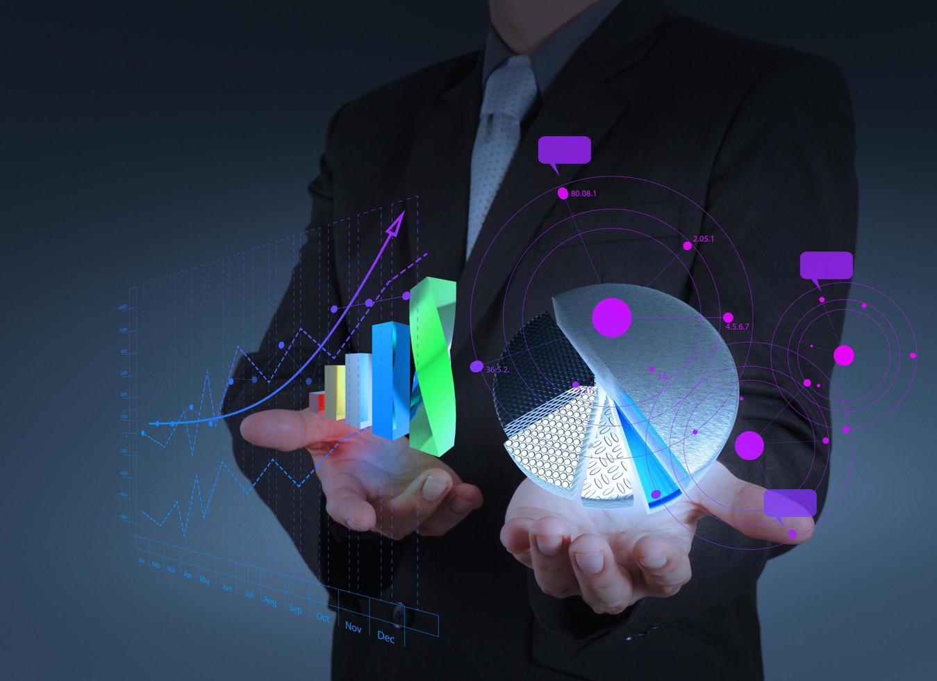 businessman hand holds graph bar and pie growth photo