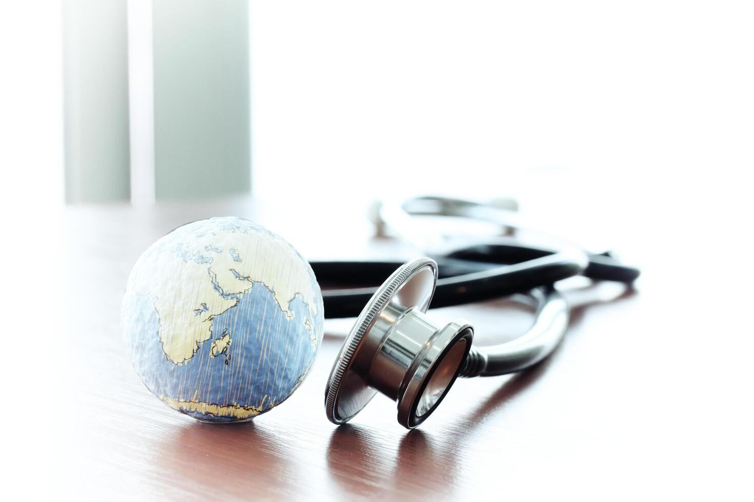 Studio macro of a stethoscope and texture globe with shallow DOF evenly matched abstract as medical network concept Elements of this image furnished by NASA photo