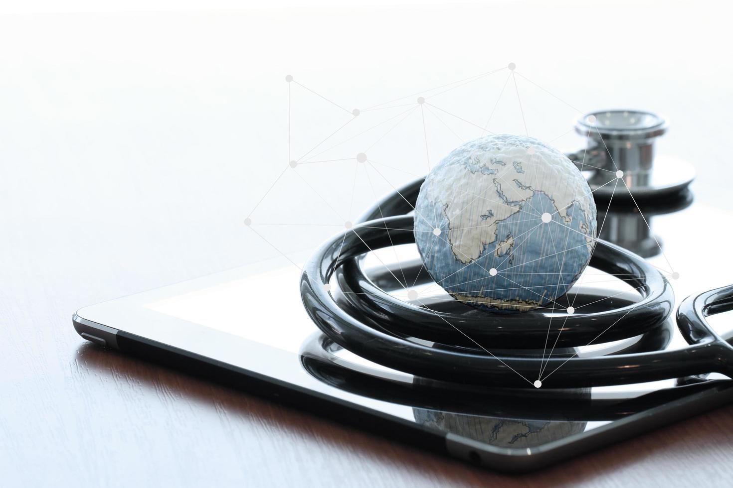 Studio macro of a stethoscope and texture globe with digital tablet with shallow DOF evenly matched abstract as medical network concept Elements of this image furnished by NASA photo