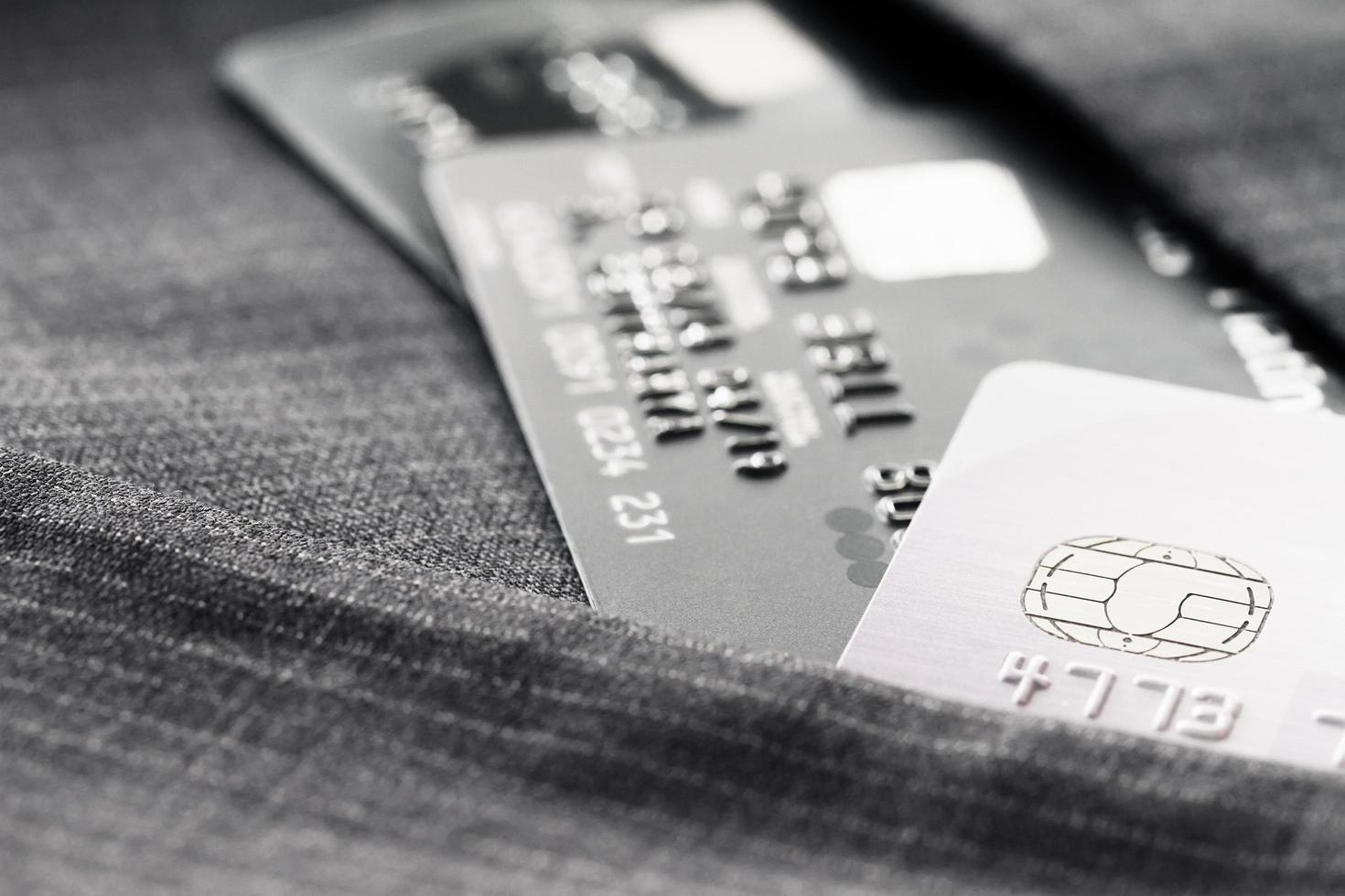 Credit cards in very shallow focus with gray suit background photo