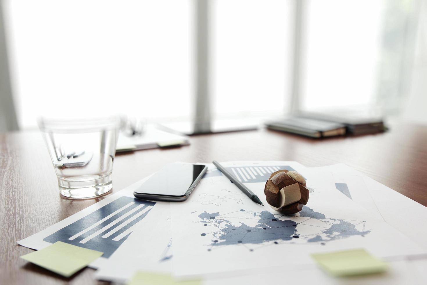 wooden texture globe with social media diagram on business document in office desk  as internet concept photo