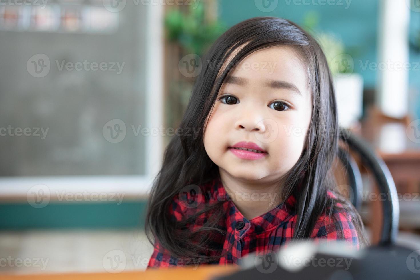 Asian Cute little girl sitting smiling photo