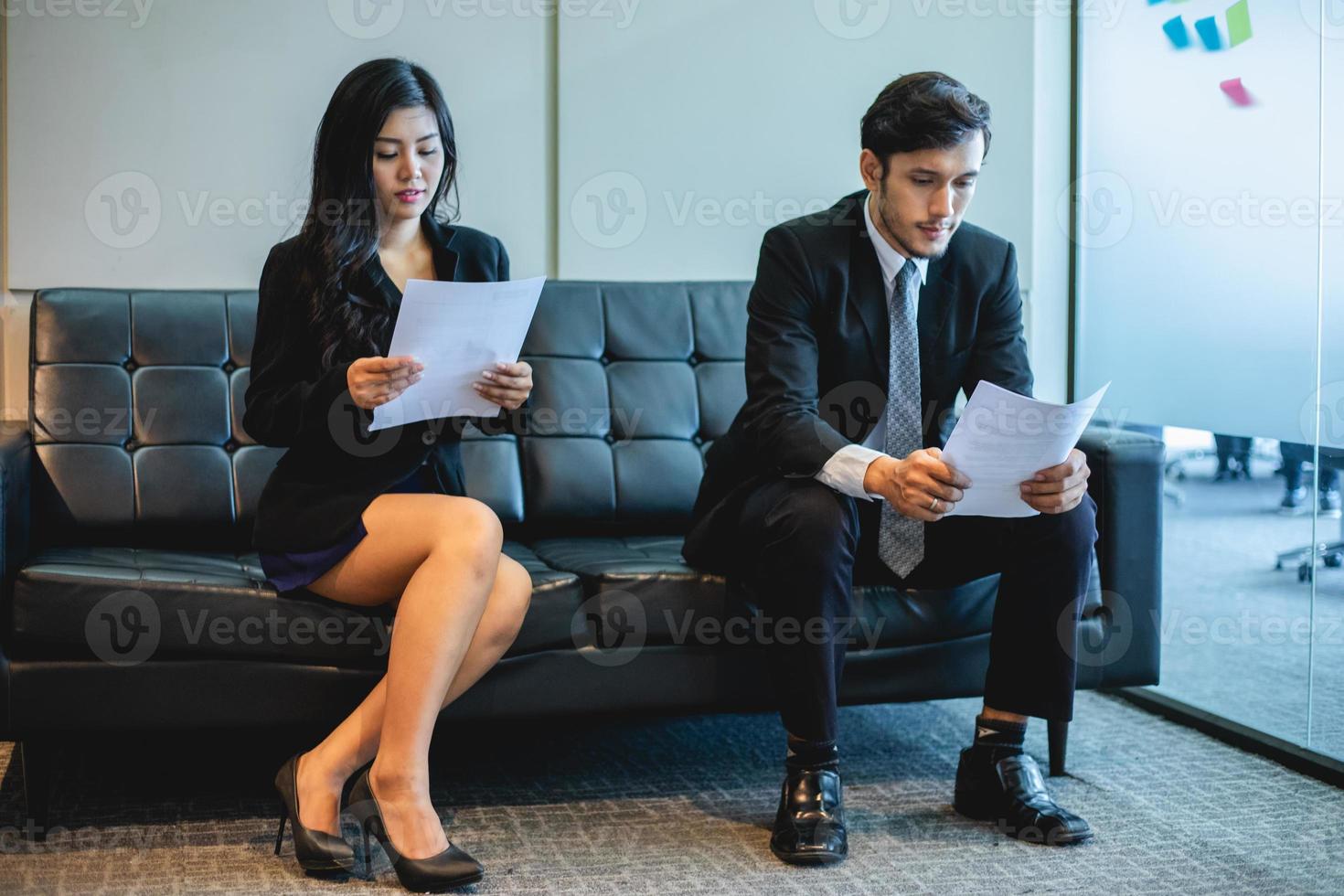 Businessmen and Businesswomen discussing documents and ideas in meeting and job interview concept photo