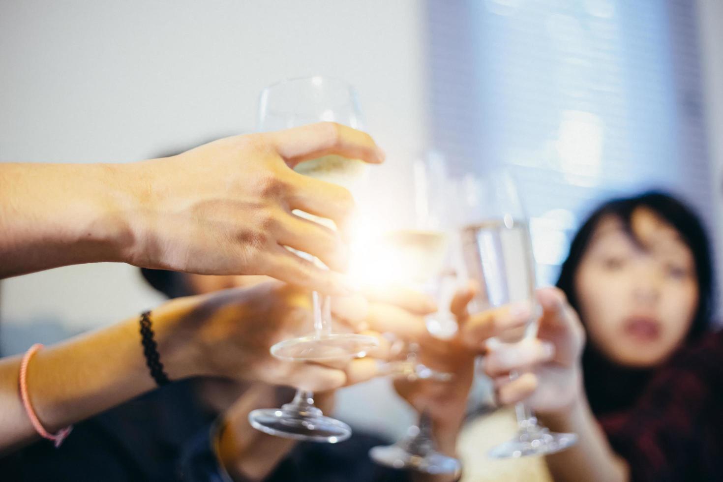 Asian group of friends having party with alcoholic beer drinks and Young people enjoying at a bar toasting cocktails photo