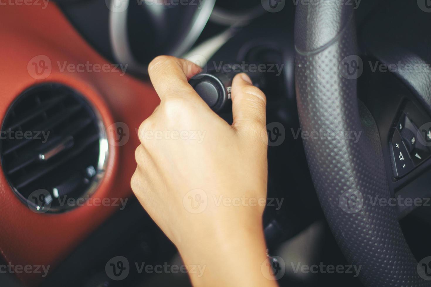 asian Woman 's hands Push button Turn Signal, button the car,selective focus on hand photo