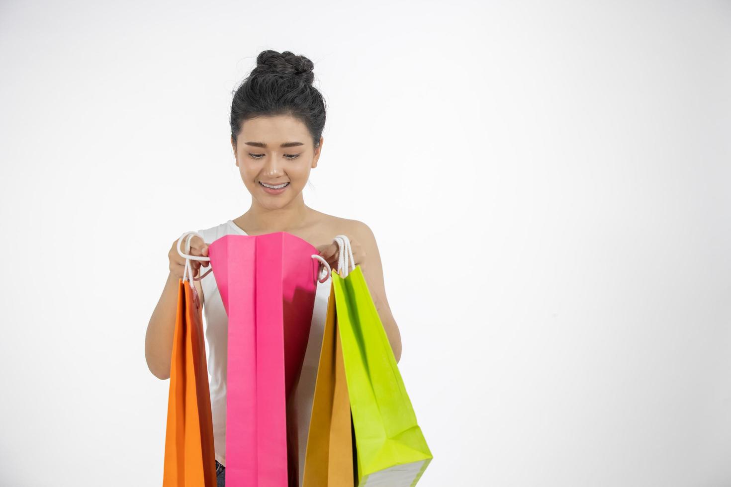 Asian women Beautiful girl is holding shopping bags and smiling photo