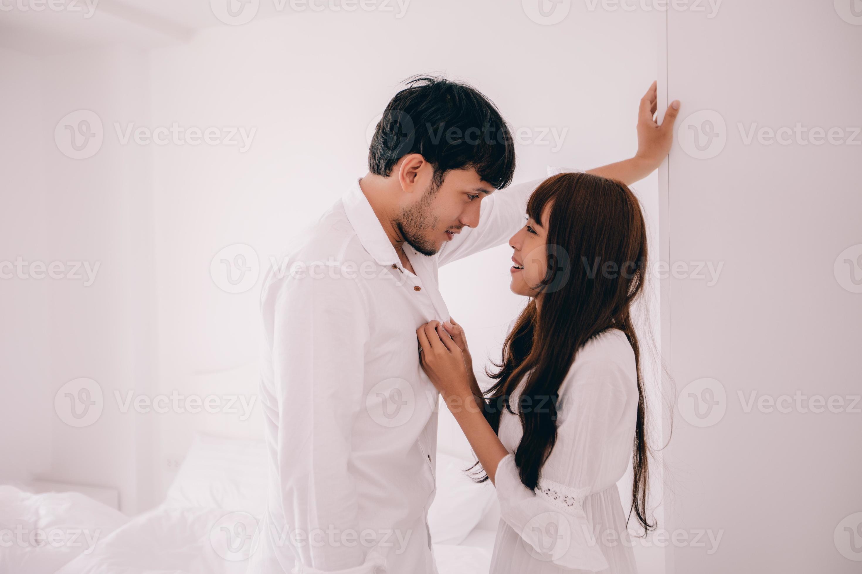 couples lover Laying On Bed room Happiness Lifestyle and smiling girl relaxing in white bed photo