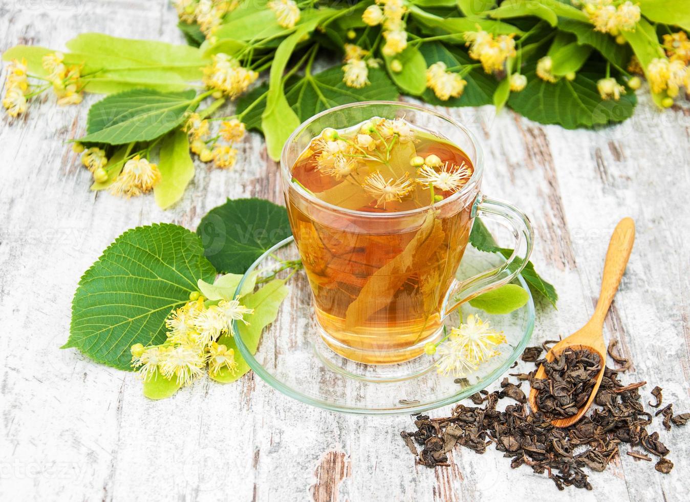 cup of herbal tea with linden flowers photo