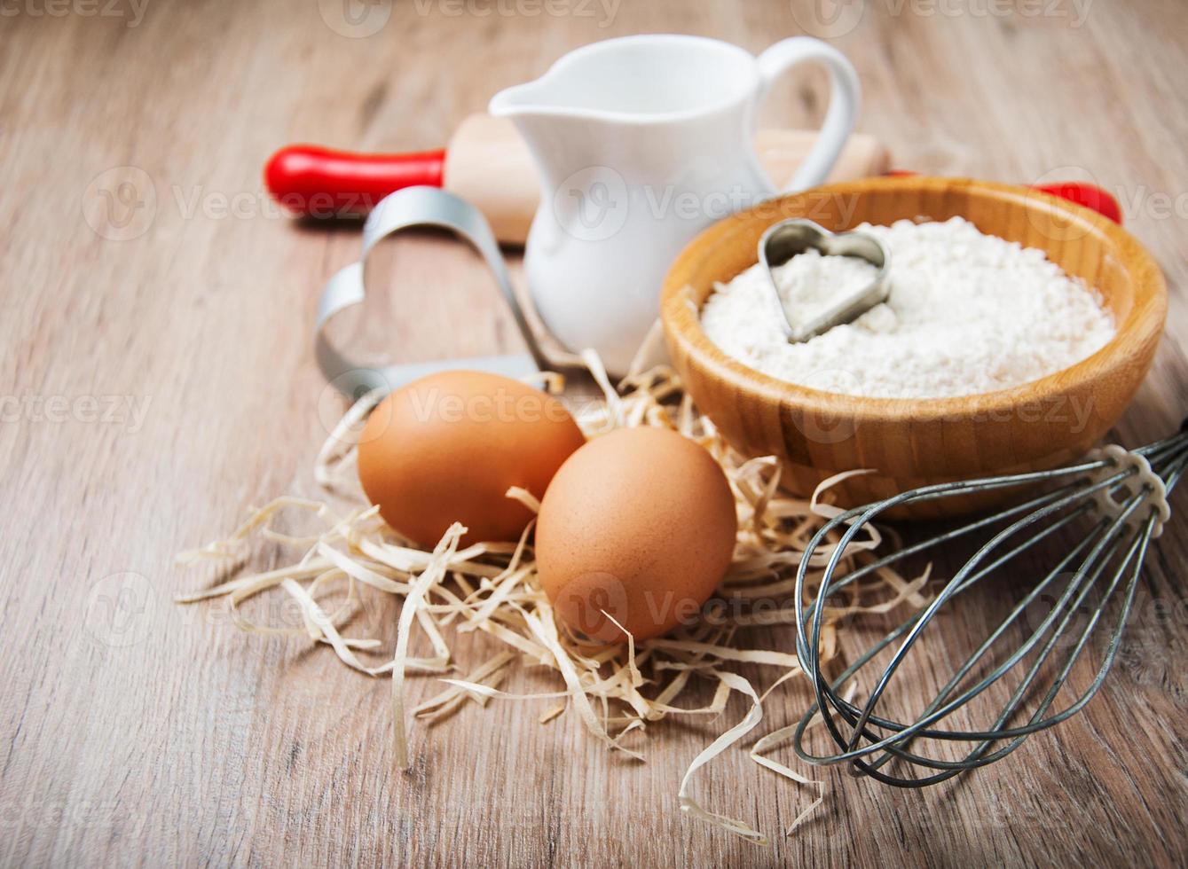 Baking ingredients - flour, eggs and pin photo