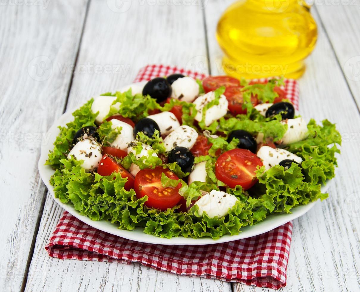 salad with mozarella cheese and vegetables photo