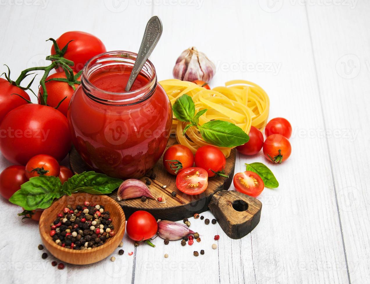 Jar with tomato sauce photo