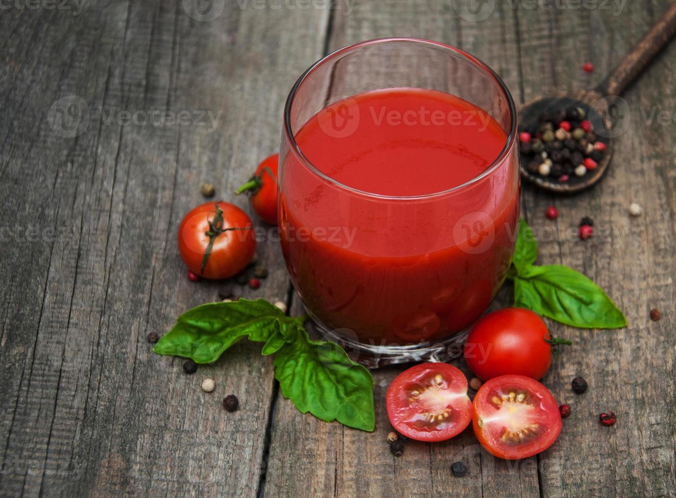 Glass with tomato juice photo
