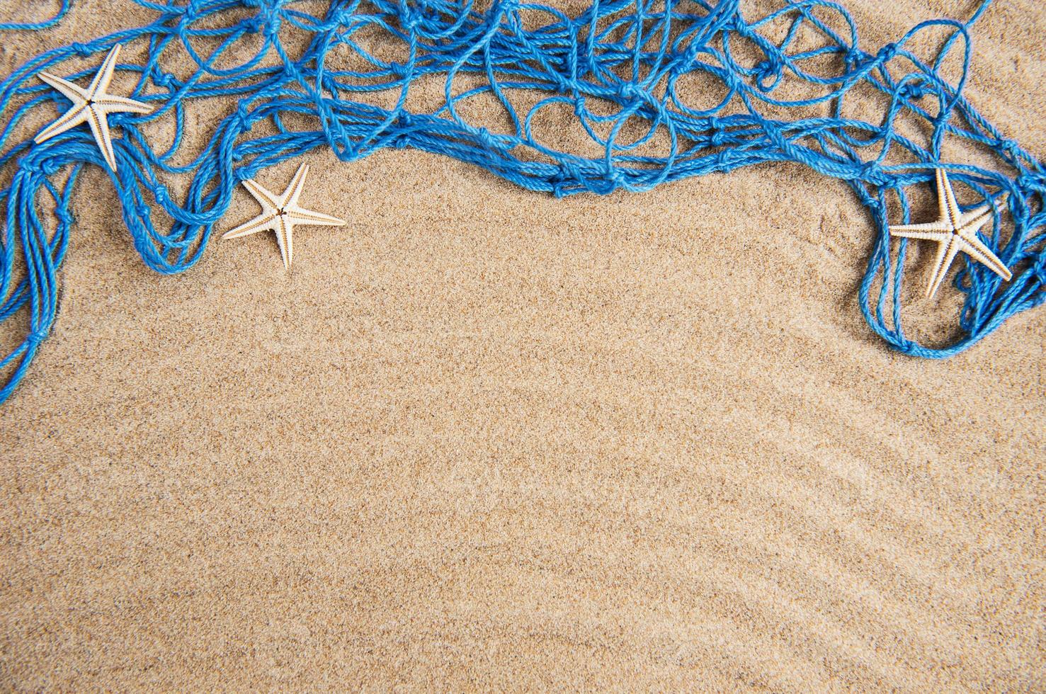 Fishing net with starfish photo