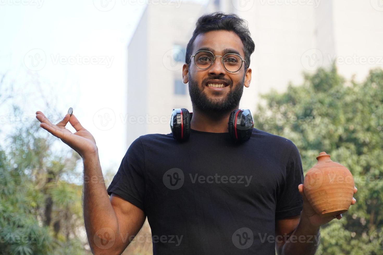 A man wearing goggles and Aladdin's lamp in his hand photo