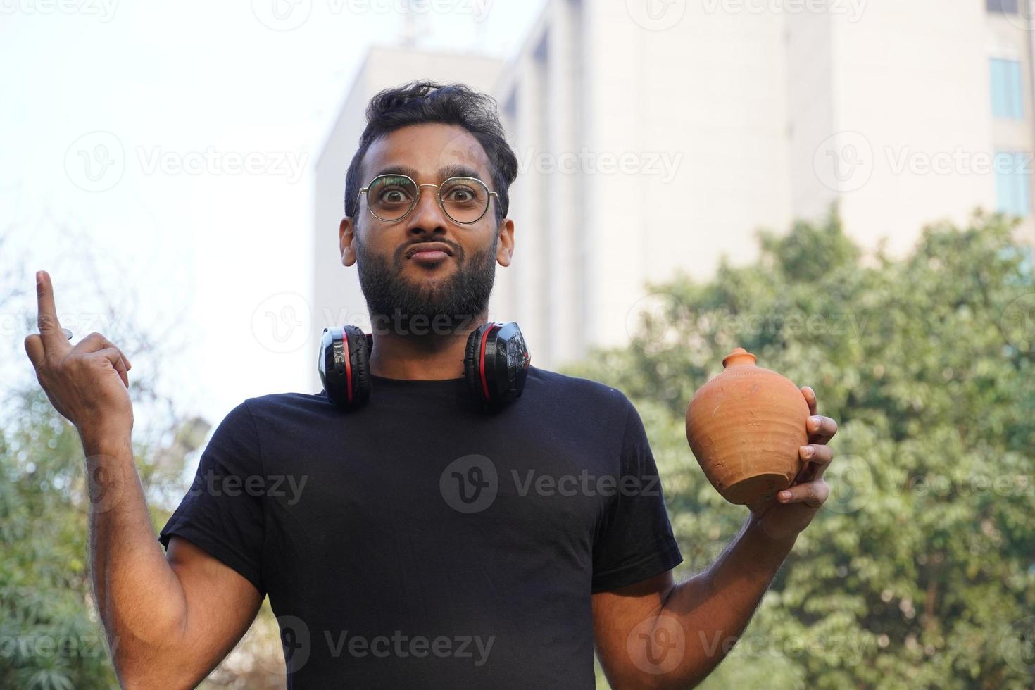 A man wearing goggles and Aladdin's lamp in his hand photo