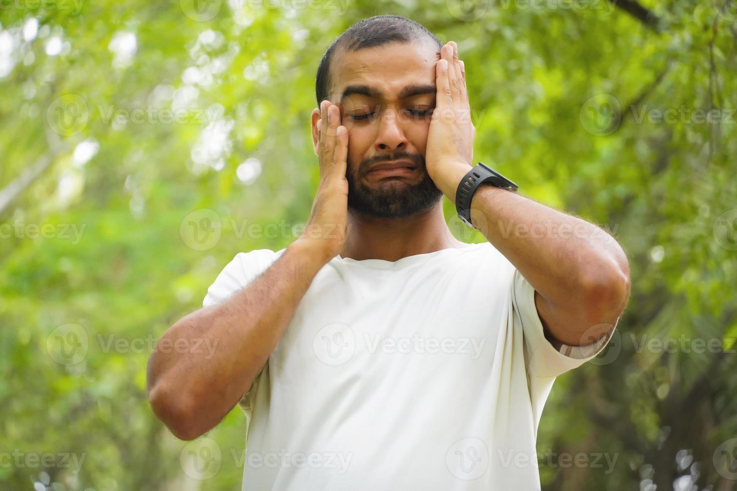 a man feels unconfident and sad photo