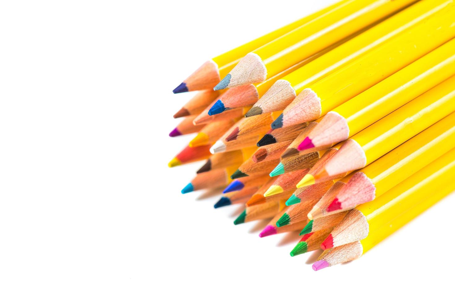 Colored pencils on white background photo