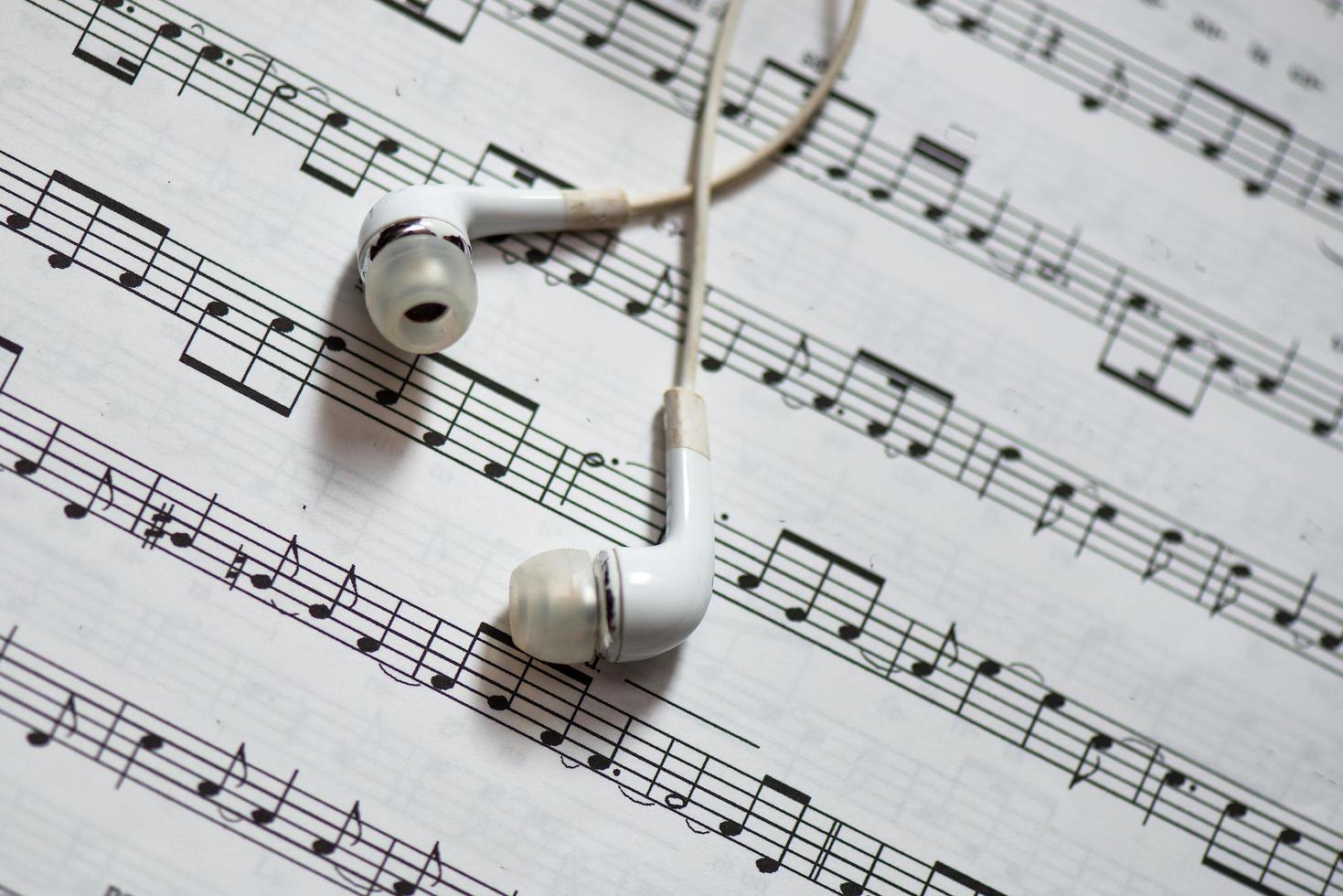 Musical score with headphones photo