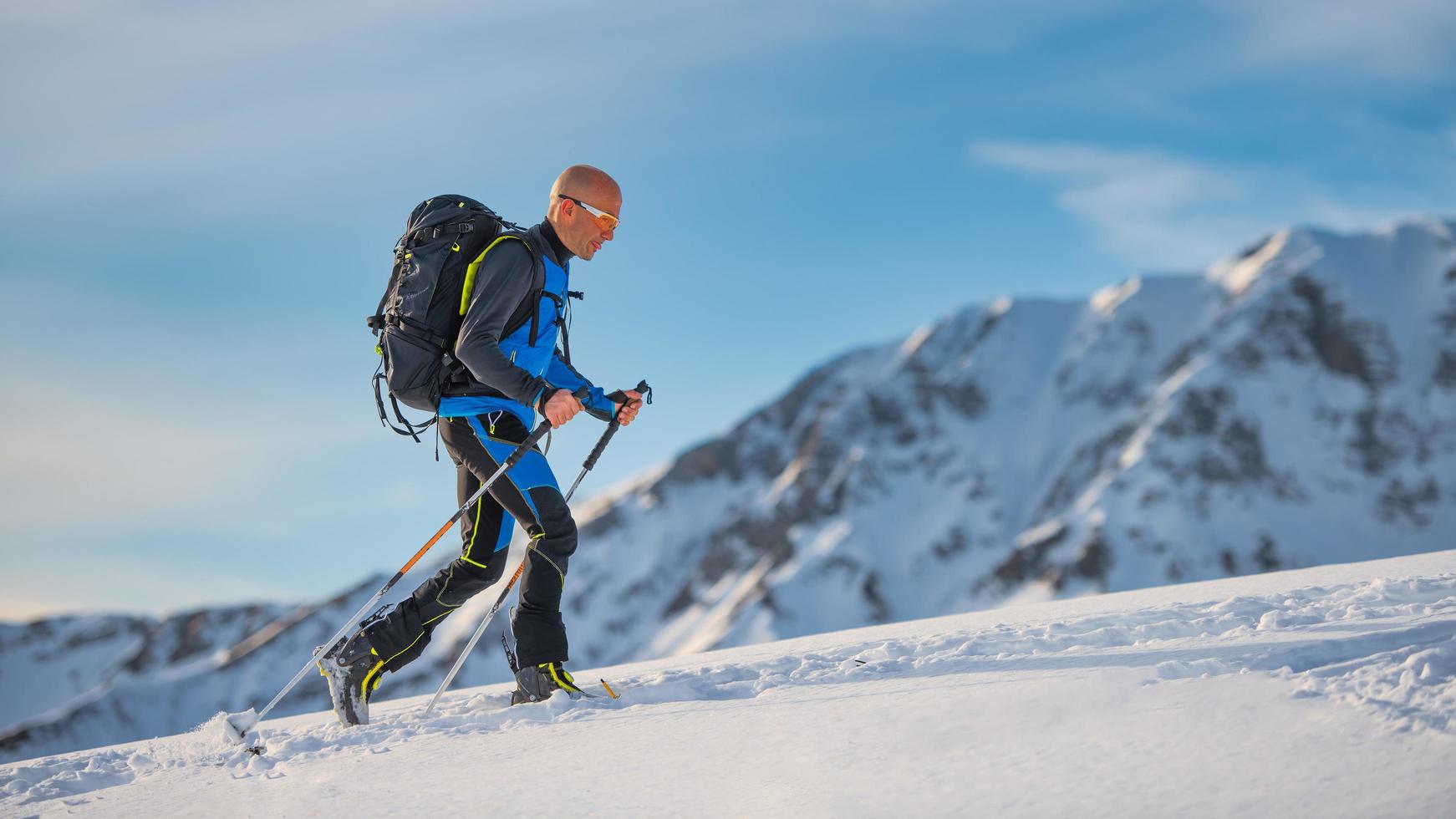 Uphill with skis and seal skins on the Alps photo