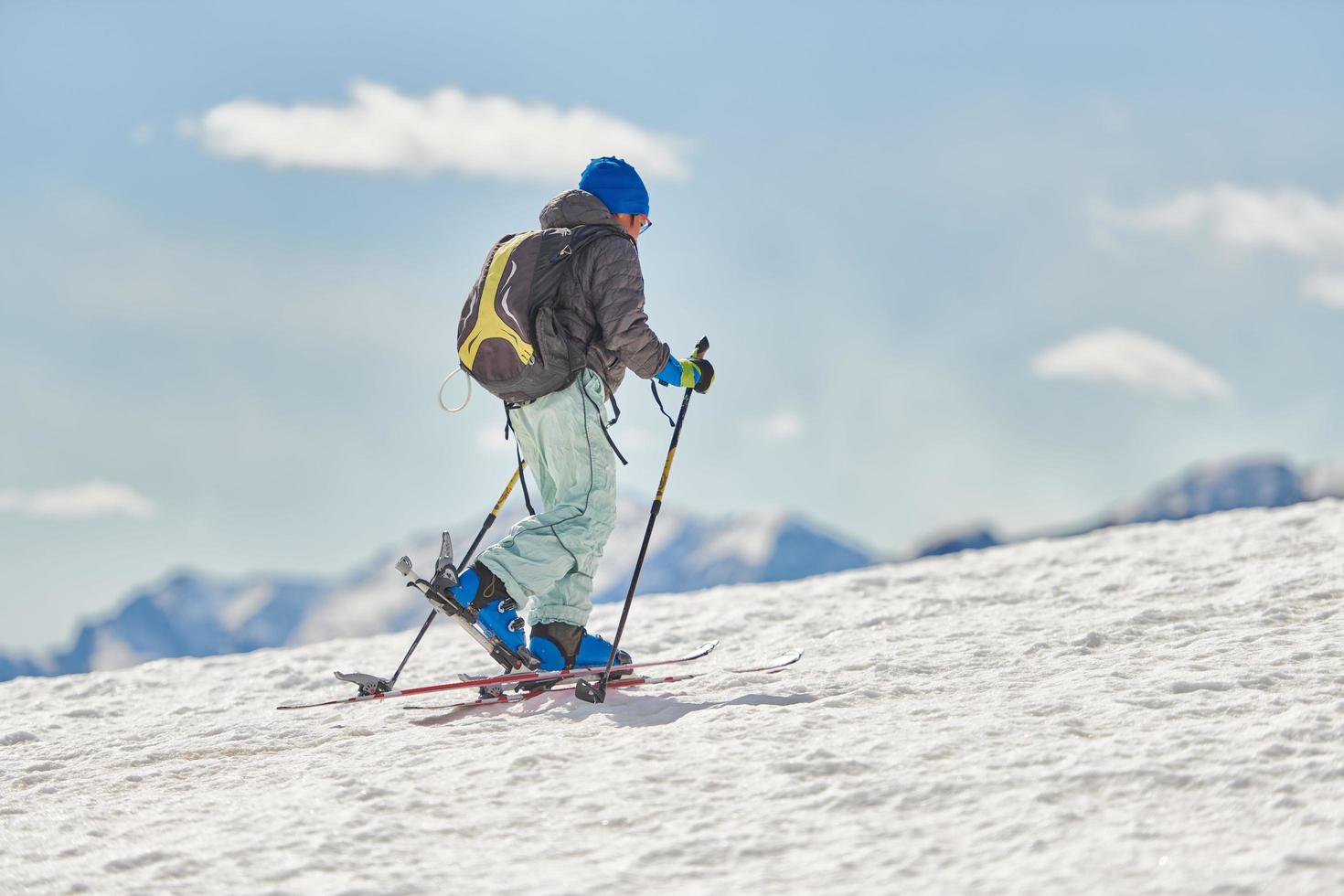 Child halls with mountaineering skis and seal skins photo