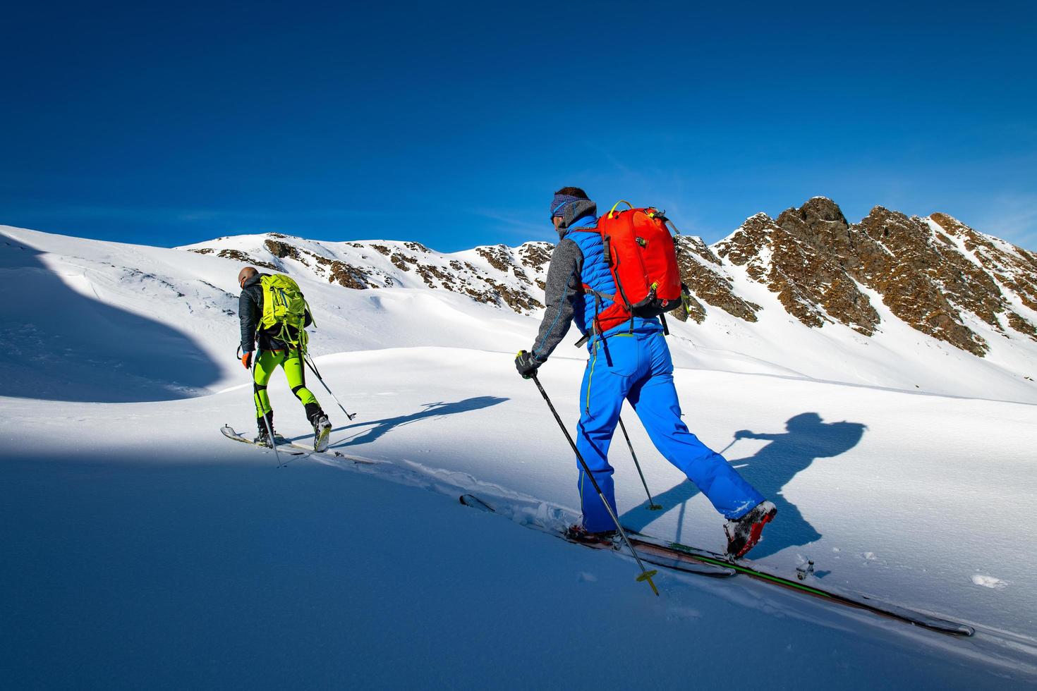 Two alpinist skiers during a ski mountaineering trip photo