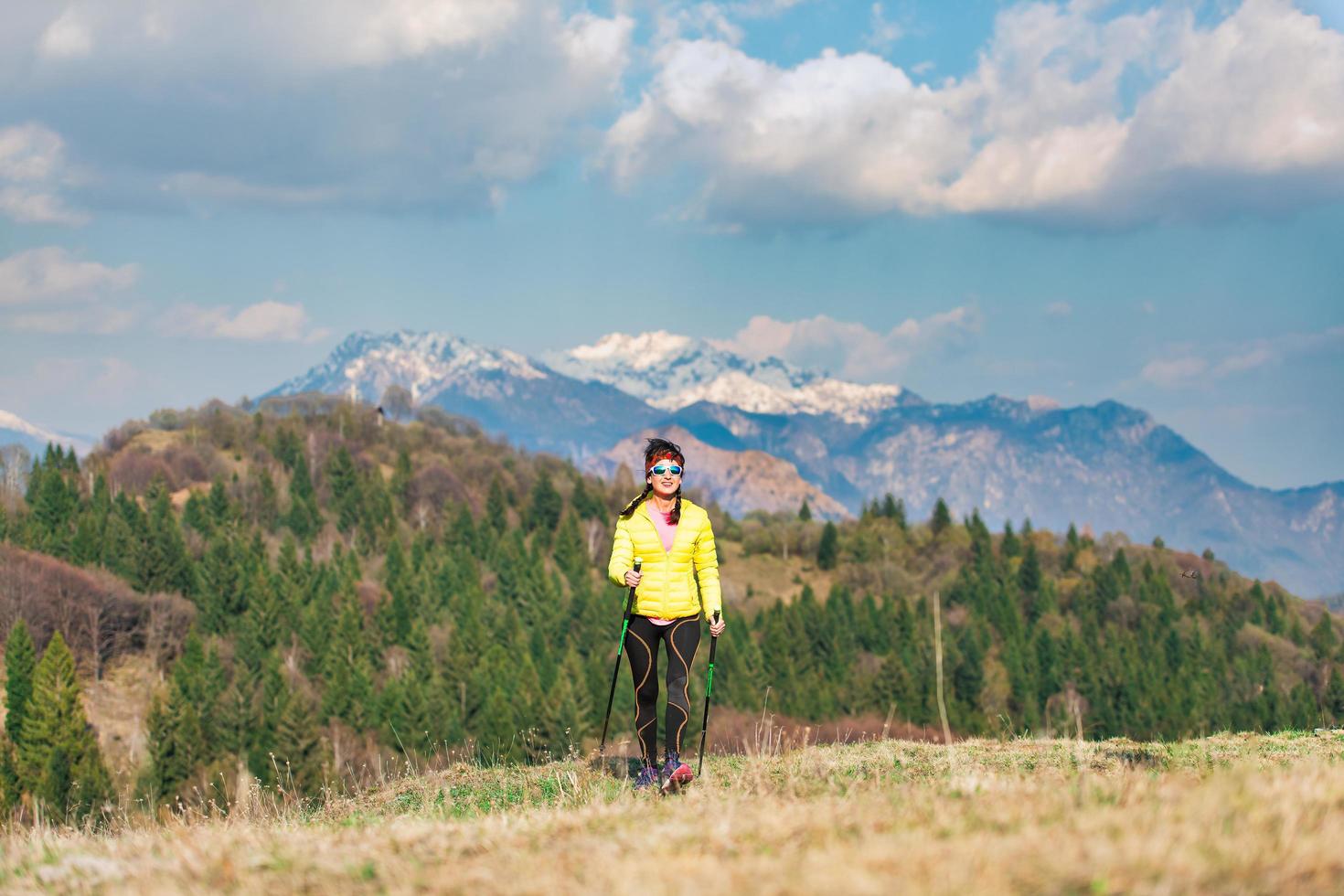 A lonely girl during a trek in the mountains in spring photo