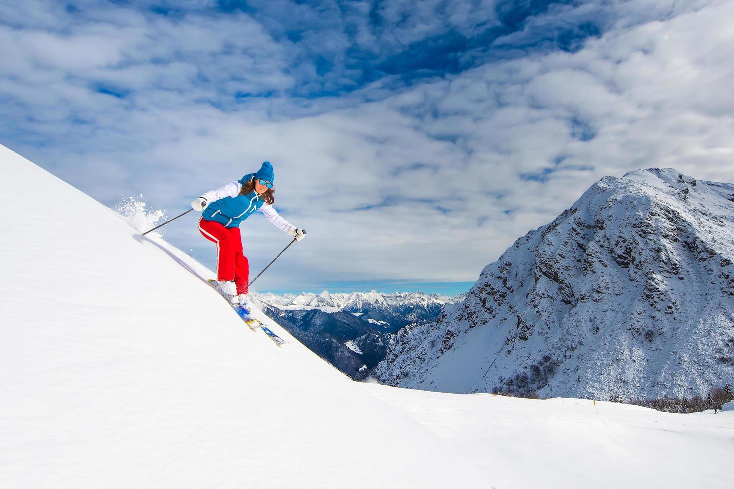 Girl in off-piste skiing photo
