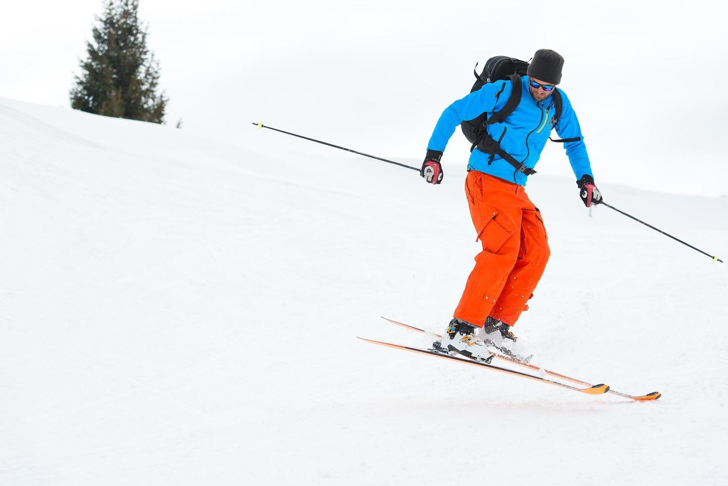 Skier jump downhill photo