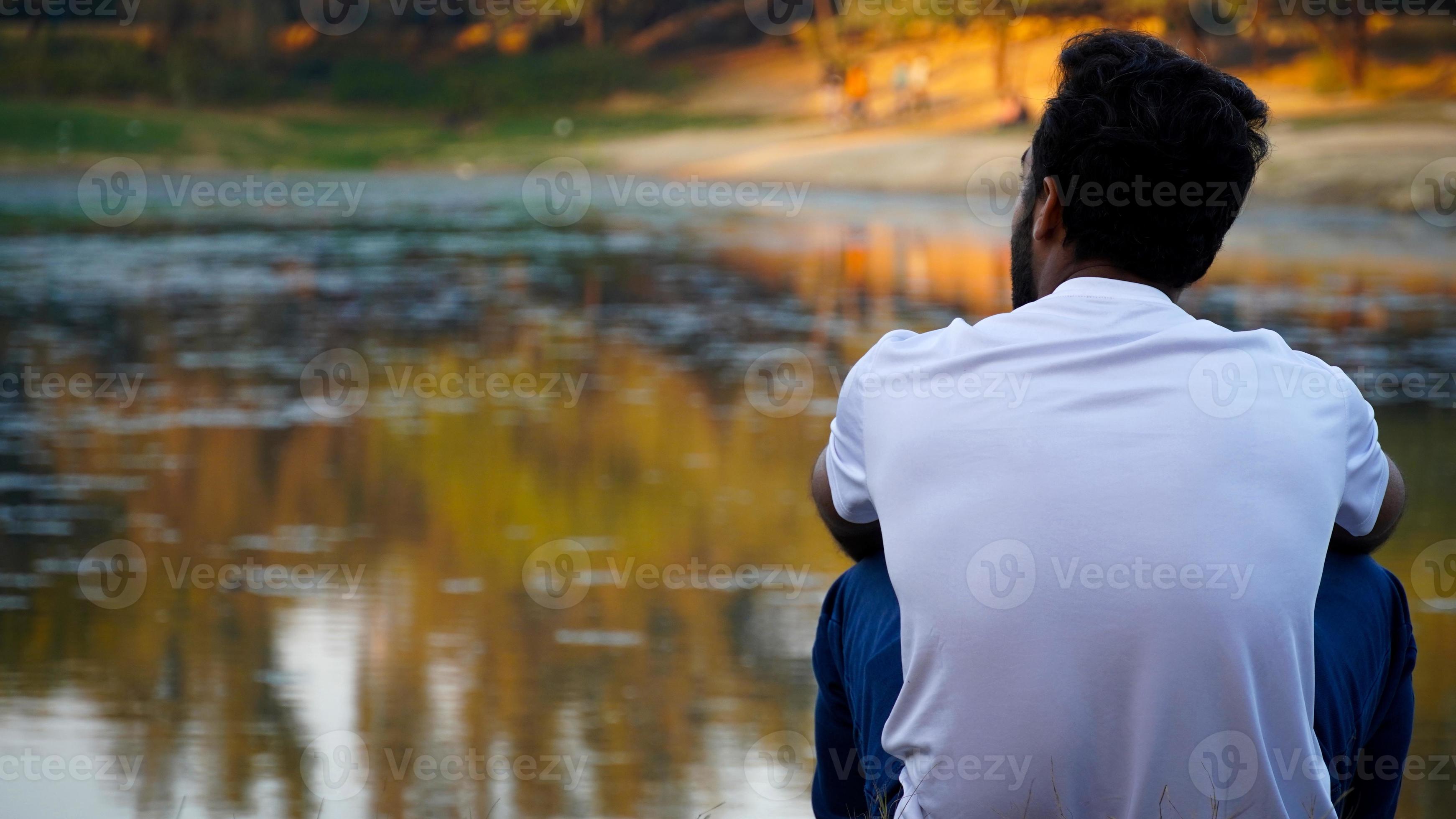 Thinking Man Sitting Alone On Sea Beach feeling alone and sad 5254986 Stock  Photo at Vecteezy