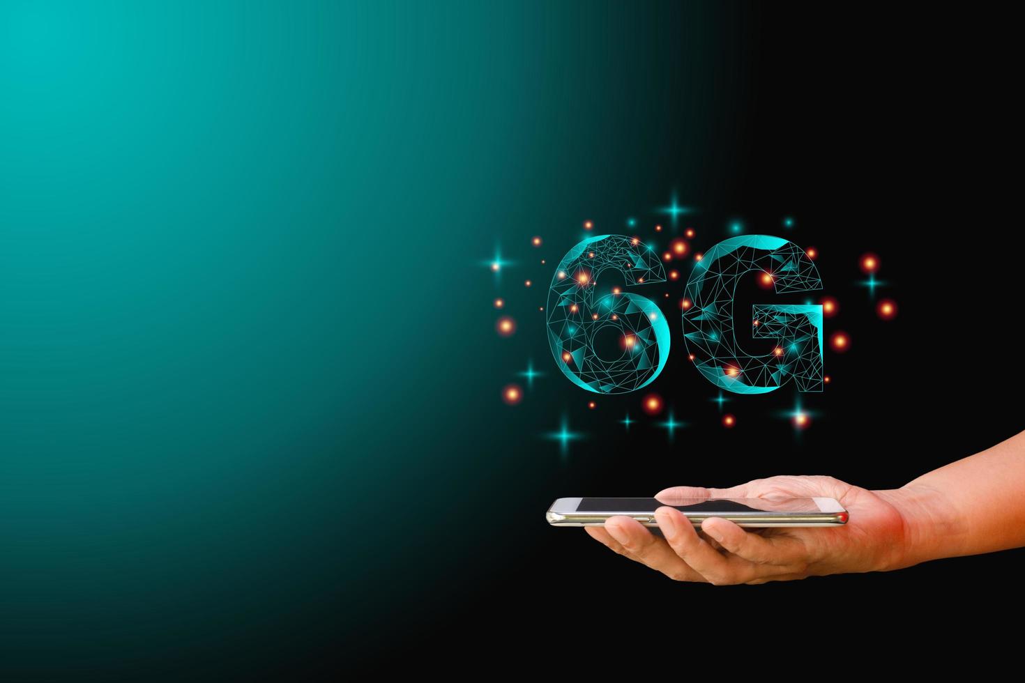 Mobile phone data technology and telecommunication global network concept. Hand-holding mobile or smartphone with low polygon dot connect line shape of 6G on dark background. photo