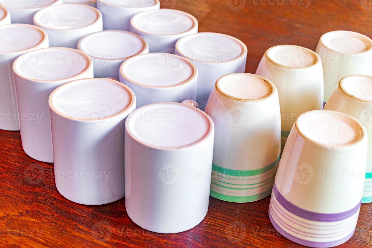 White coffee cups on wooden table tropical Holbox island Mexico. photo