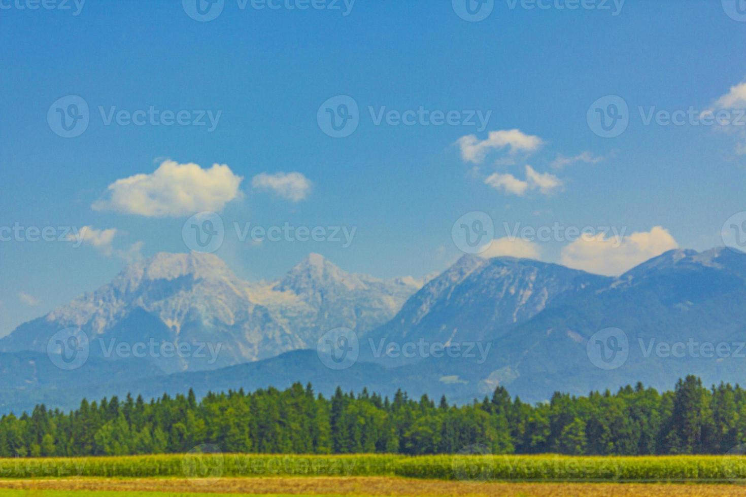 Wonderful mountain and forest landscape with cloudy sky in Slovenia. photo