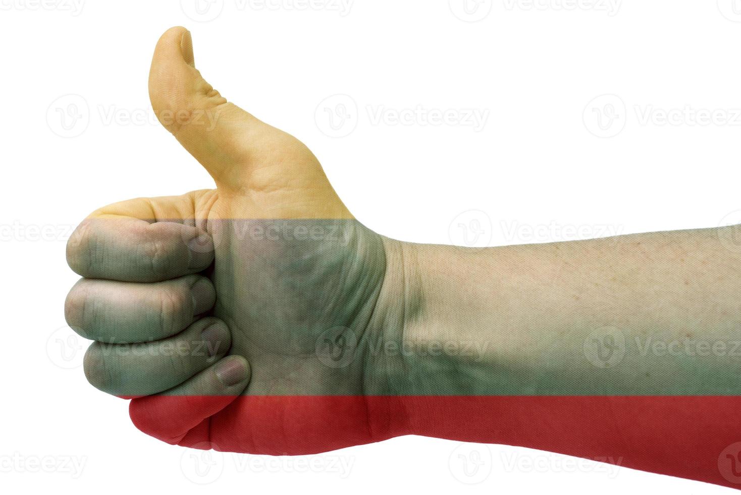 The concept of the Lithuania-hand gives a thumbs up with the flag of Lithuania. photo