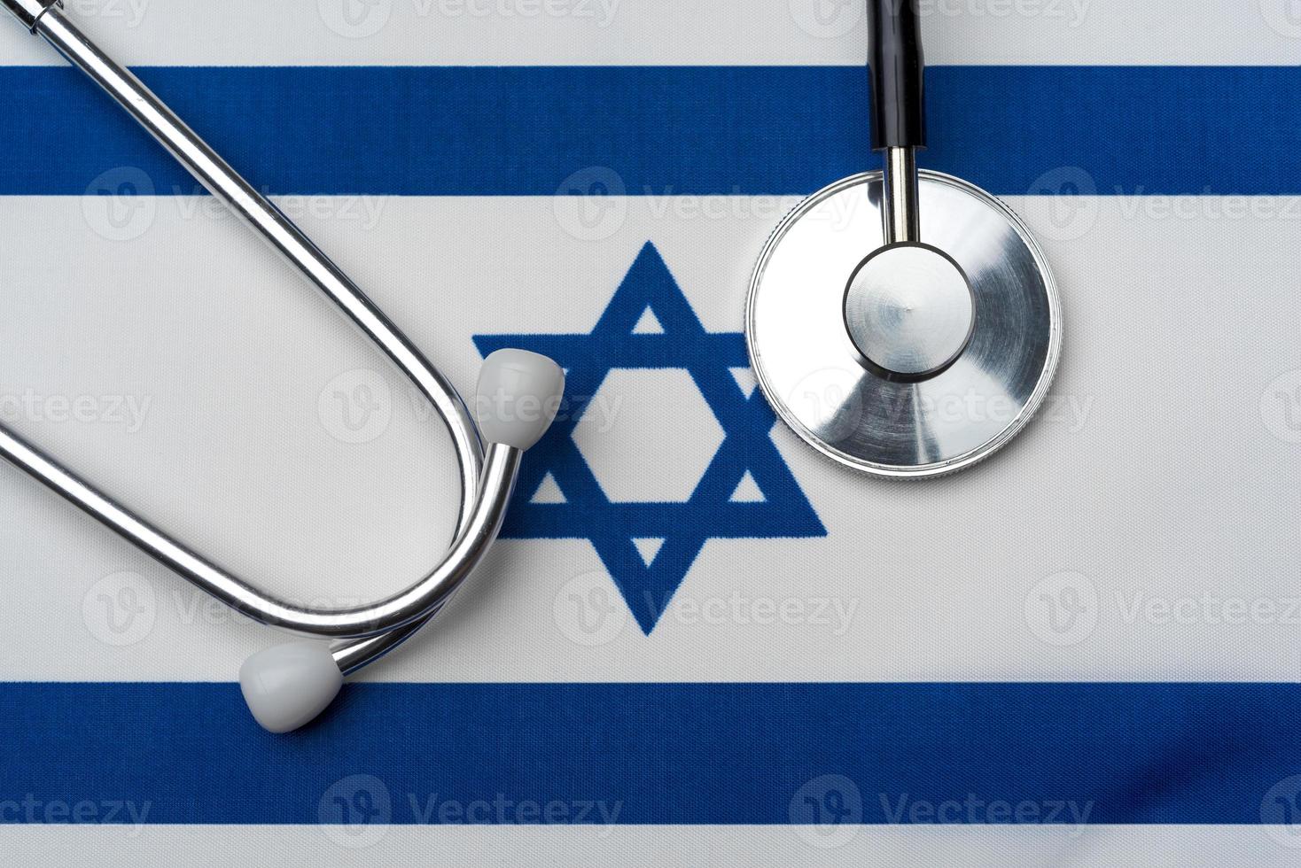 The flag of Israel and a stethoscope. The concept of medicine. photo