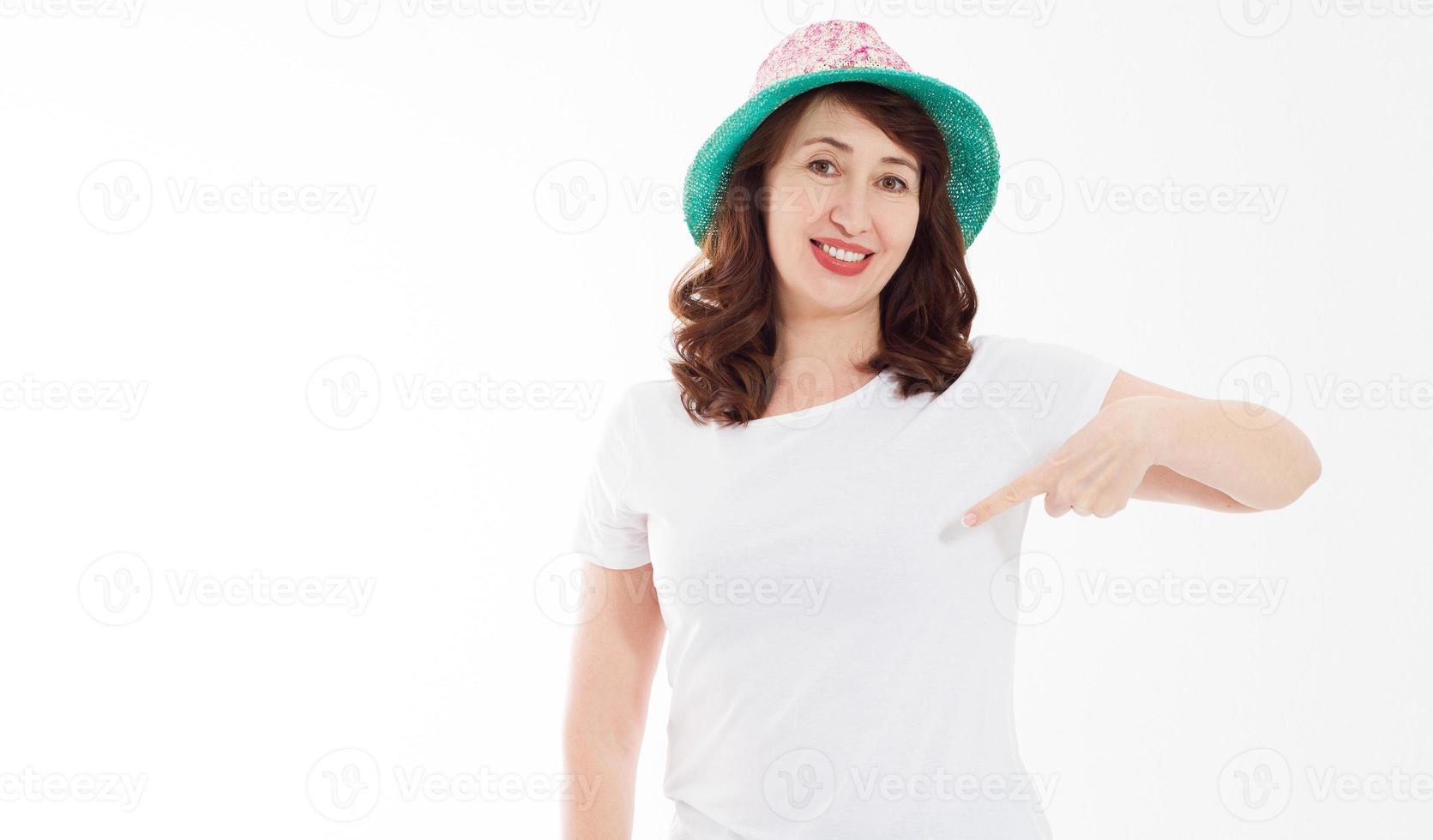 Summer t shirt design and people concept close up of woman in blank template white t-shirt and beach hat point on copy space on white tshirt. Mock up. Front view. Banner photo