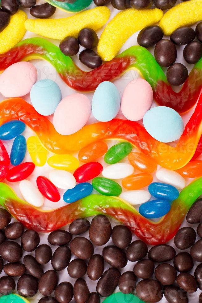 Colorful candy, lollipop and sweets isolated on white background. Top view. Selective focus. photo