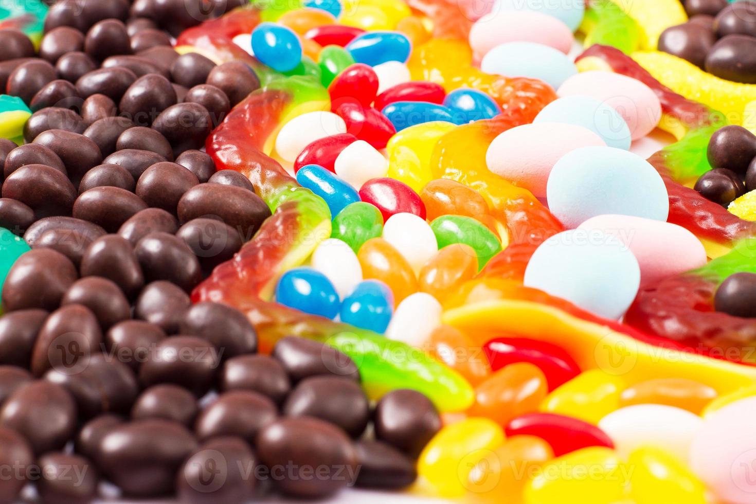 Colorful candy, lollipop and sweets isolated on white background. Top view. Selective focus. photo