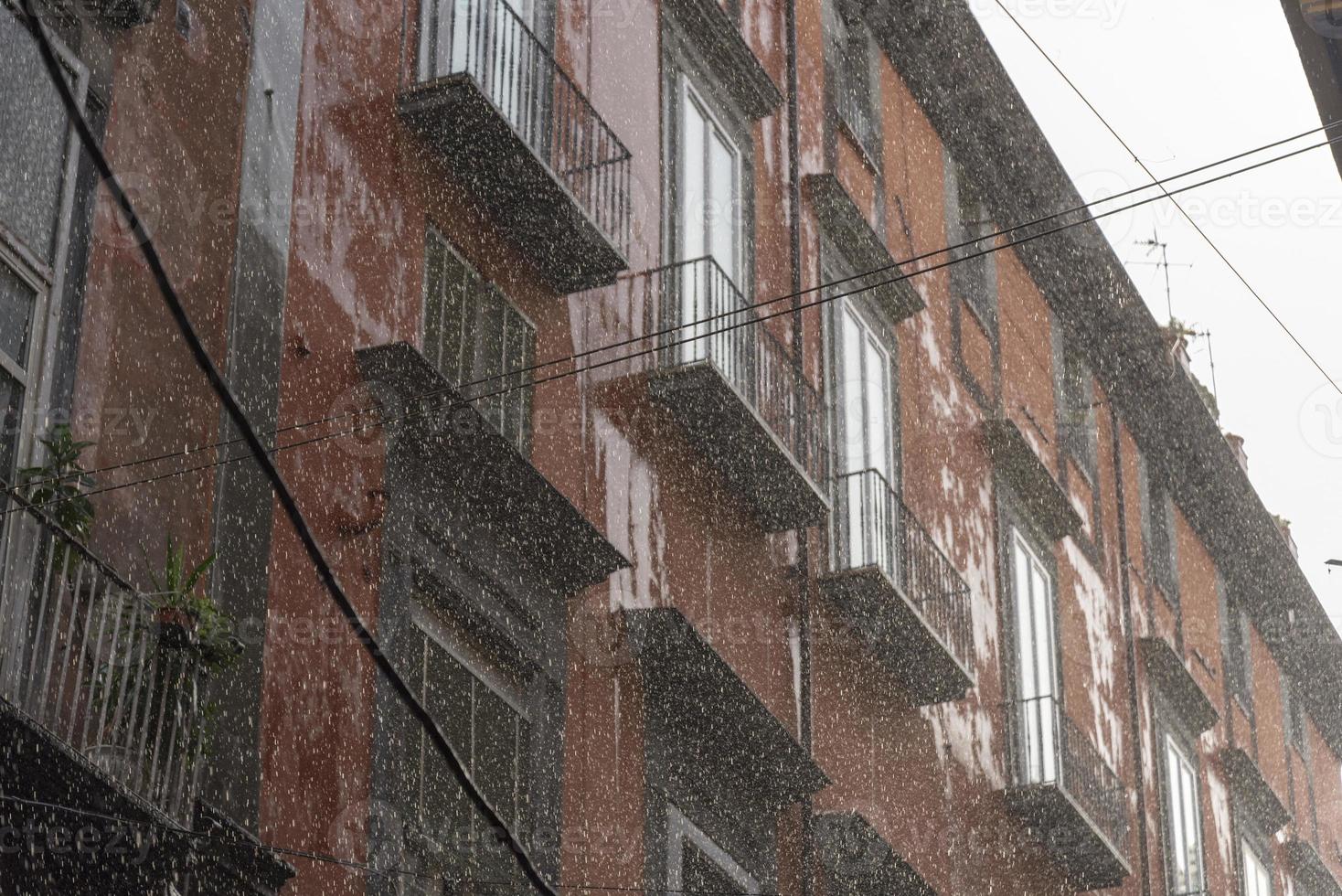 Rain, blurring and large drops of strong water flow. photo