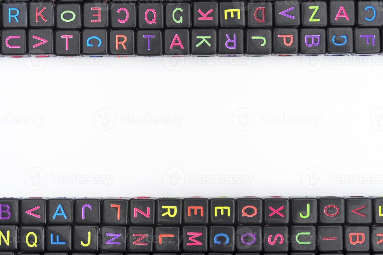 Many colorful decorative cubes with letters on a white background. photo