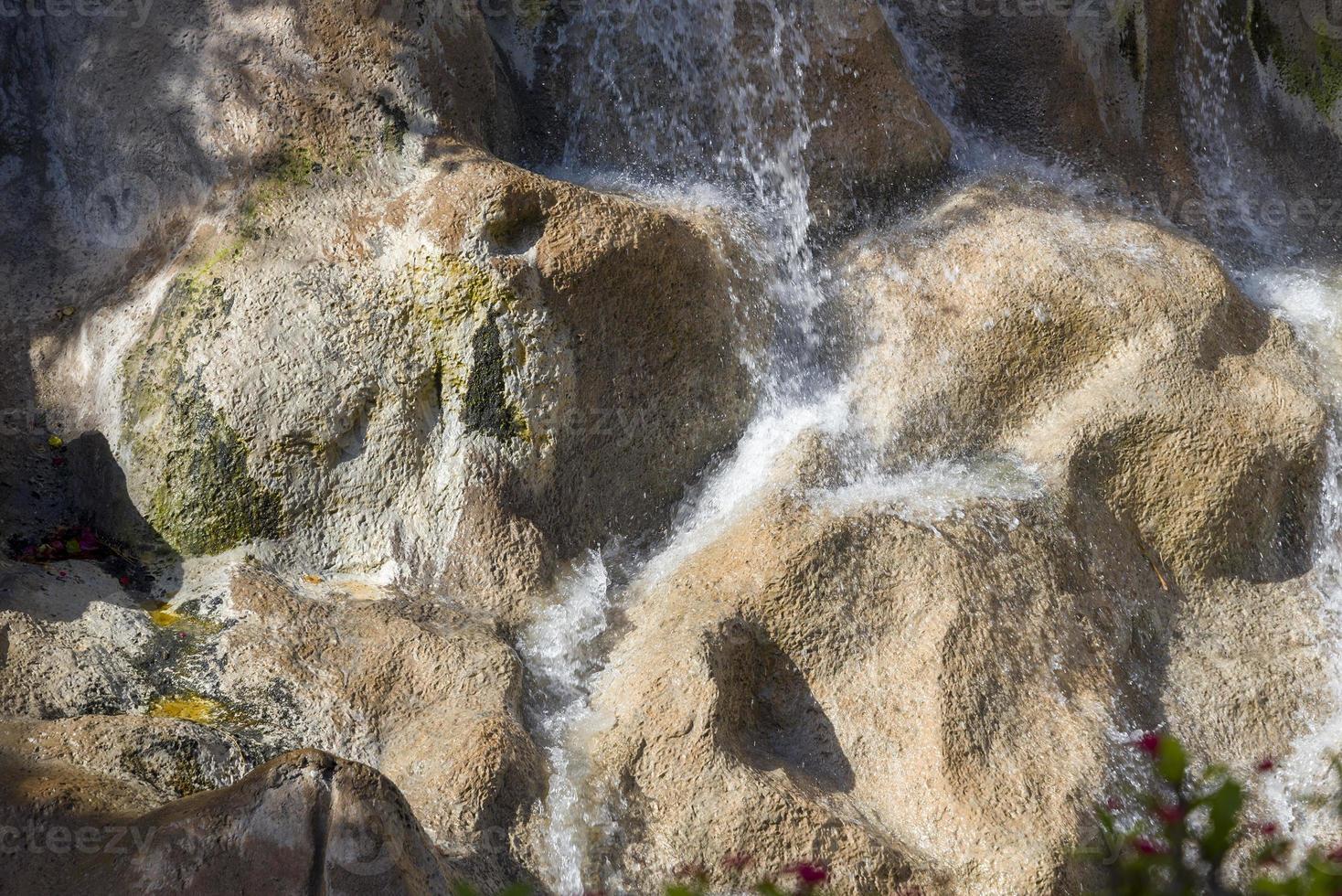 Water flows over the rocks in the Park. photo