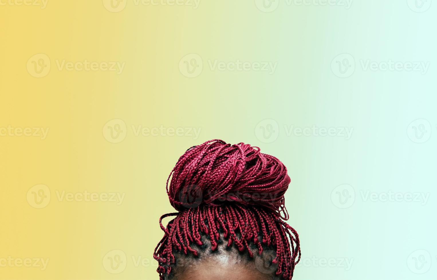 red braids with a colorful background photo