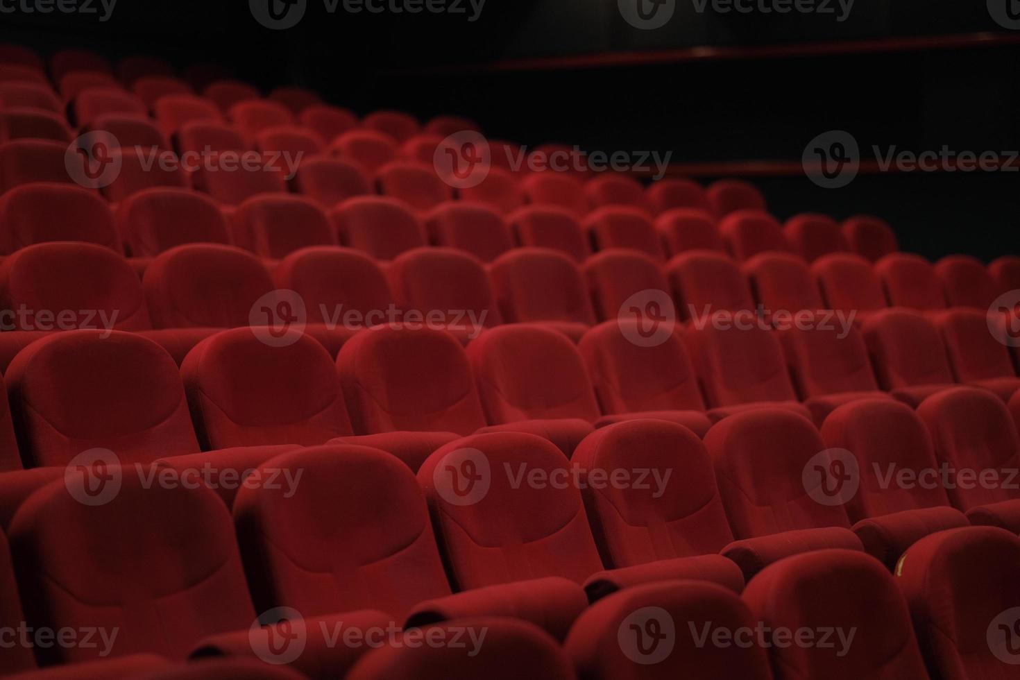 Empty cinema hall with red seats. Movie theater. photo