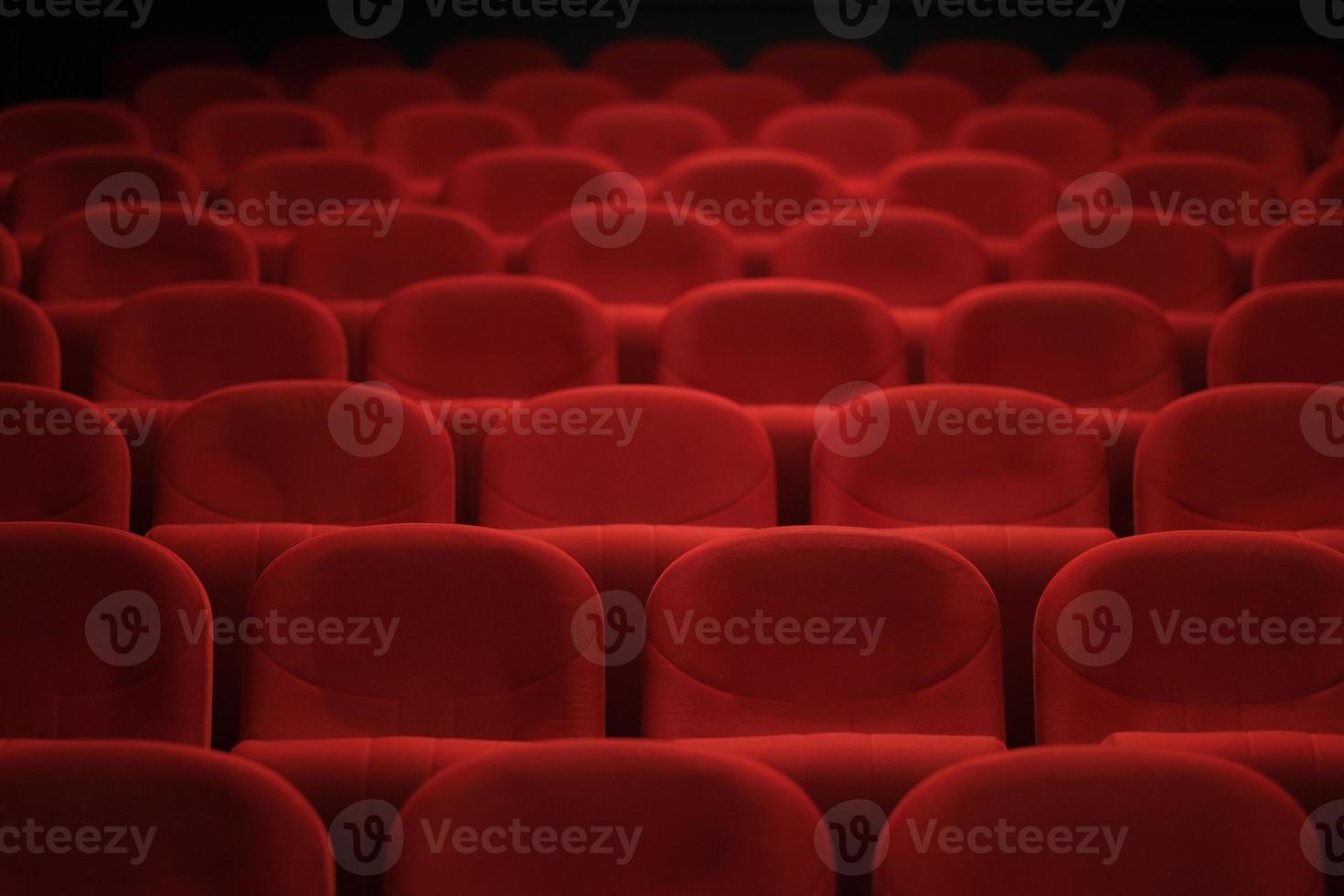 Empty cinema hall with red seats. Movie theater. photo