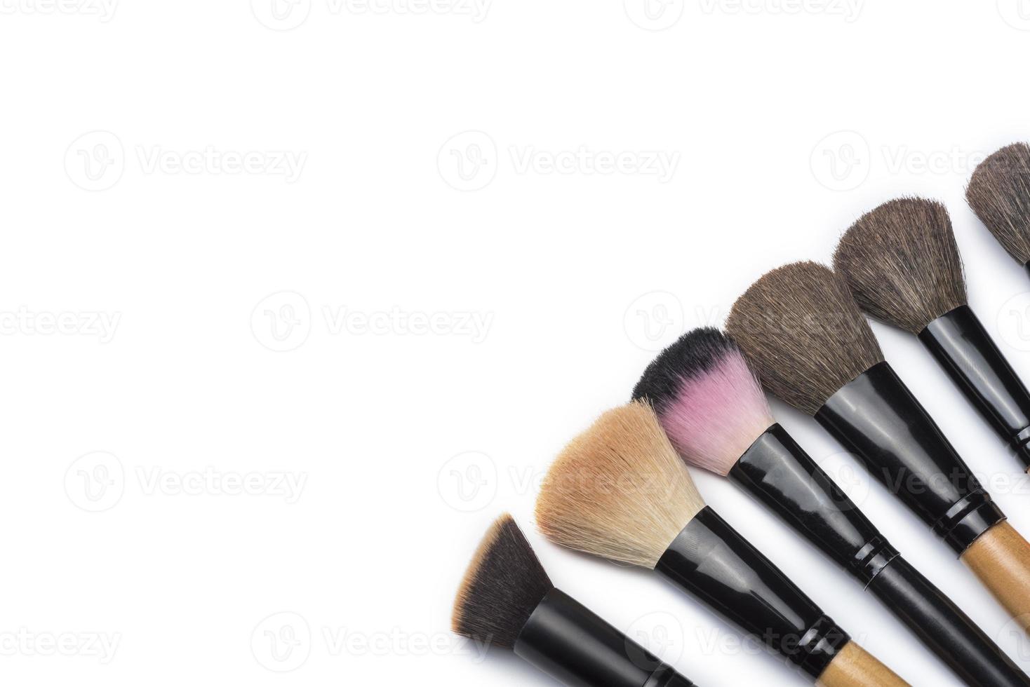 Makeup brushes on white isolated background for female beauty. photo