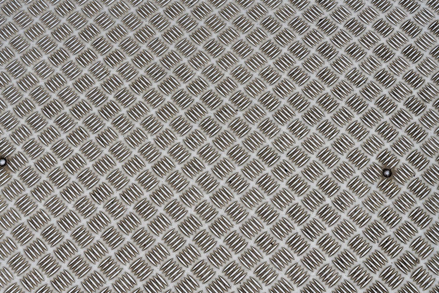 Used cellular steel plates background, metal texture. photo