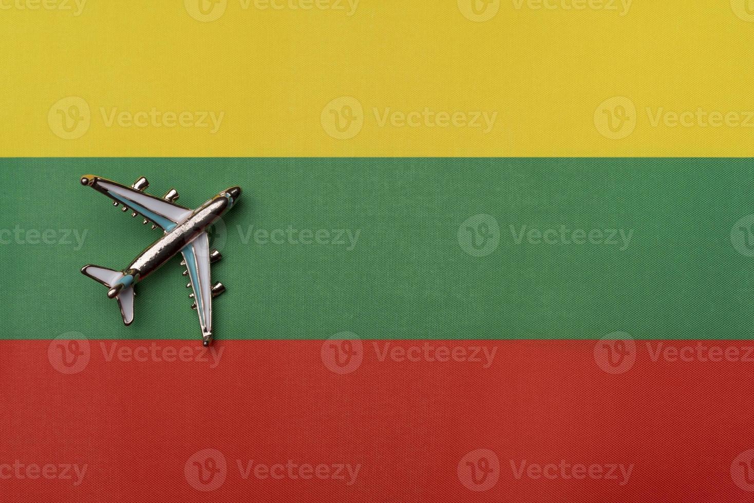 The plane over the flag of Lithuania, the concept of travel. photo