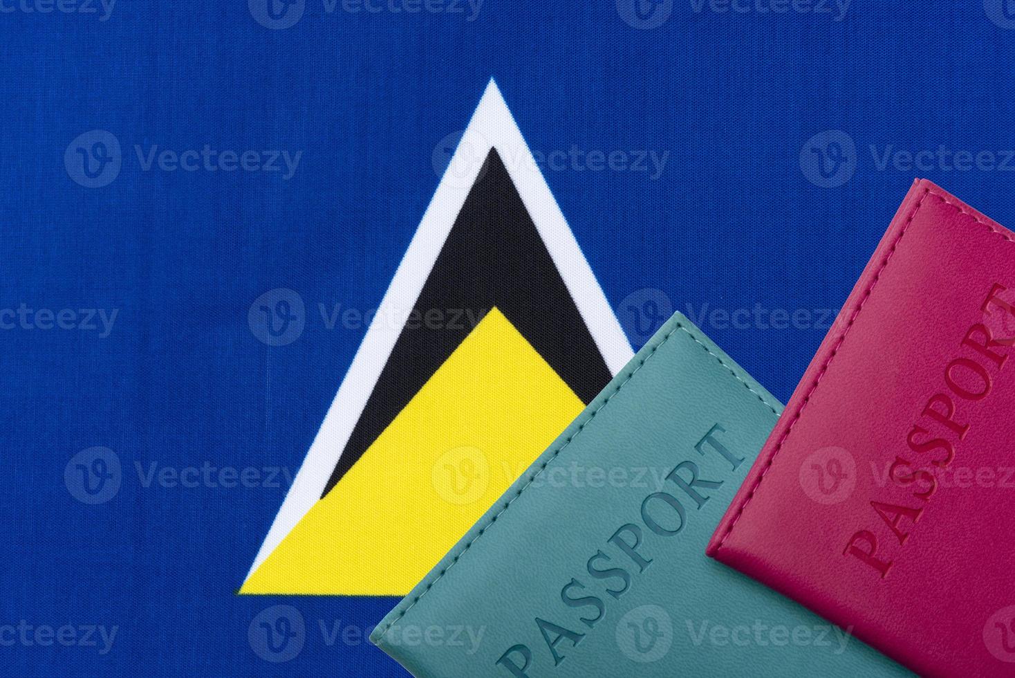 On the background of the flag of St. Lucia two passports. photo