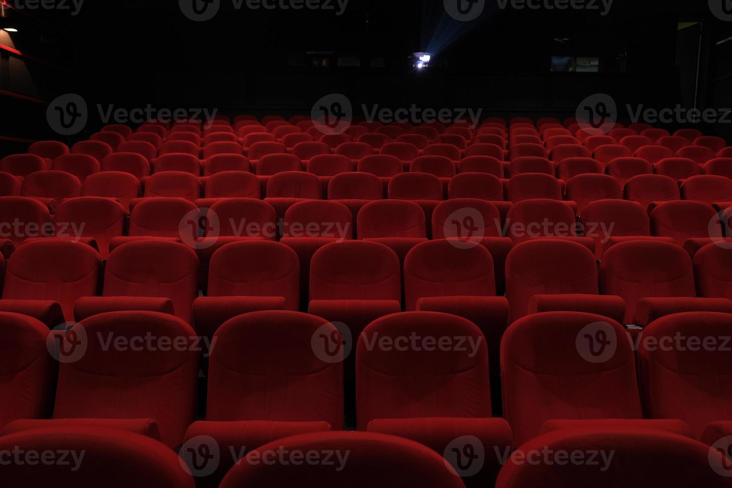 Empty cinema hall with red seats. Movie theater. photo